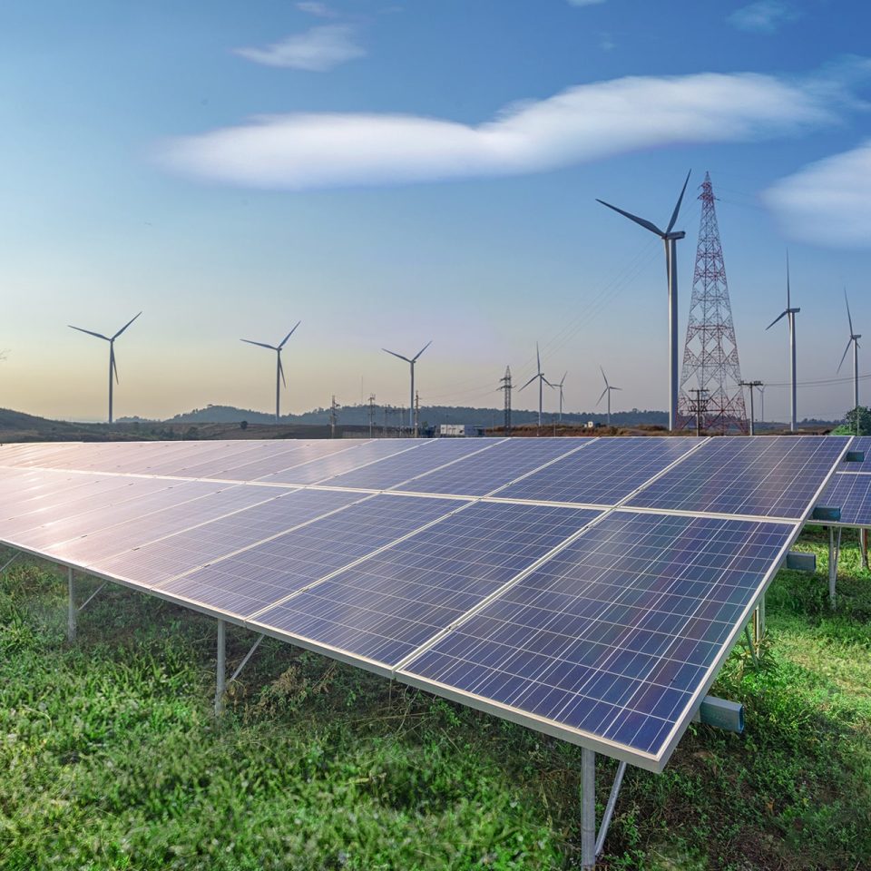 renewable-energy-solar-panels-wind-turbines-green-grass-blue-sky renewable-energy-solar-panels-wind-turbines-green-grass-blue-sky